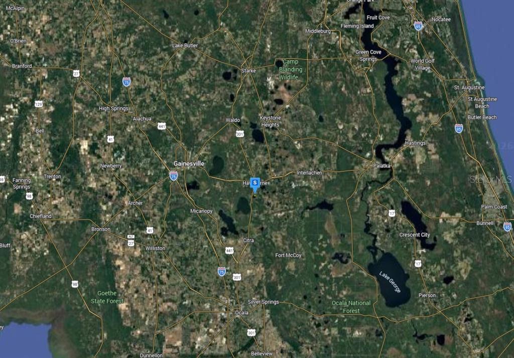 This is a satellite map showing the region surrounding Gainesville, Florida — 22010 SE 111 AVE, HAWTHORNE, FL