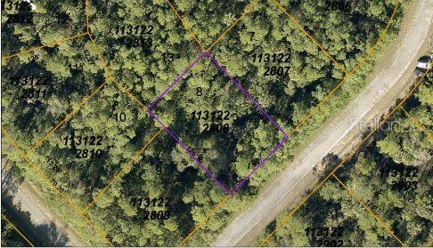 This is an aerial map view showing a wooded lot outlined in purple — JUBILEE CIRCLE, NORTH PORT, FL