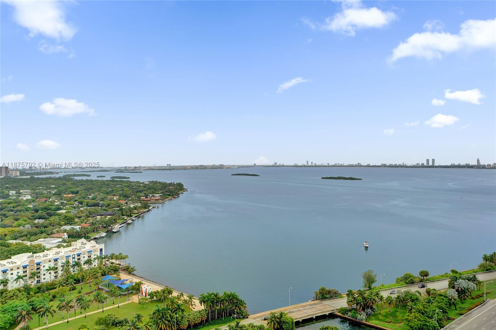 An aerial view shows a coastal park, a bridge, and a large body of water — 601 NE 36th St # 2703, Miami FL 33137, MIAMI, FL