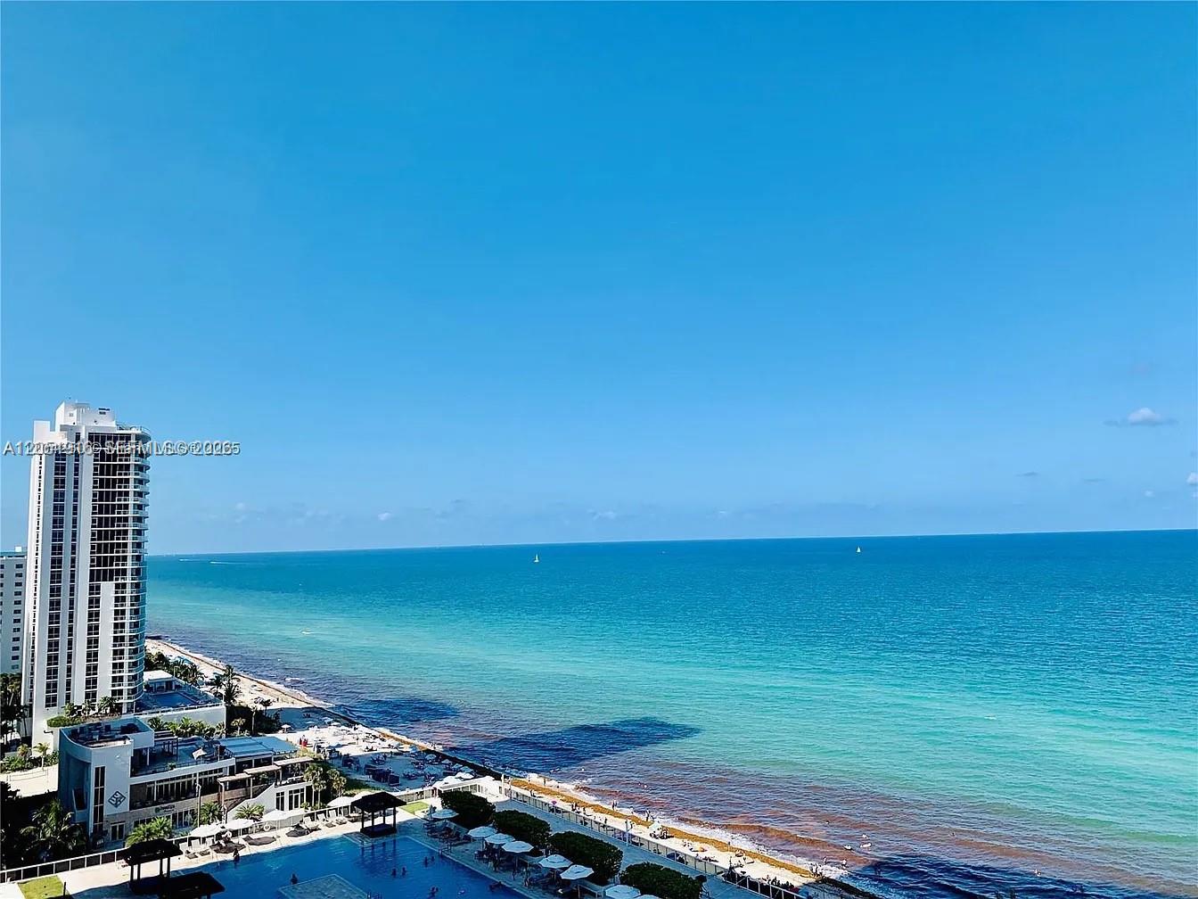 An elevated view of a beach, ocean, and a high-rise building with a pool deck — 1830 S Ocean Dr # 4007, Hallandale Beach FL 33009, HALLANDALE BEACH, FL