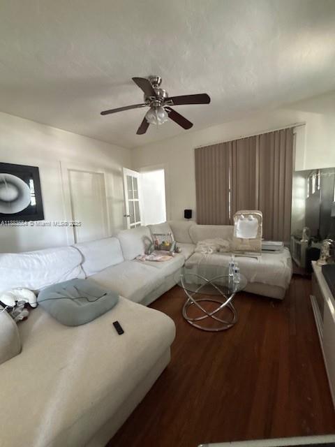 A living room features a large white sectional sofa, a ceiling fan, and hardwood floors — 2643 NW 23rd Ct, Miami FL 33142, MIAMI, FL