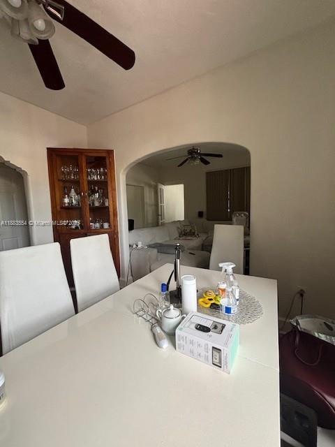 A dining room features a white table, four chairs, and a wooden china cabinet — 2643 NW 23rd Ct, Miami FL 33142, MIAMI, FL
