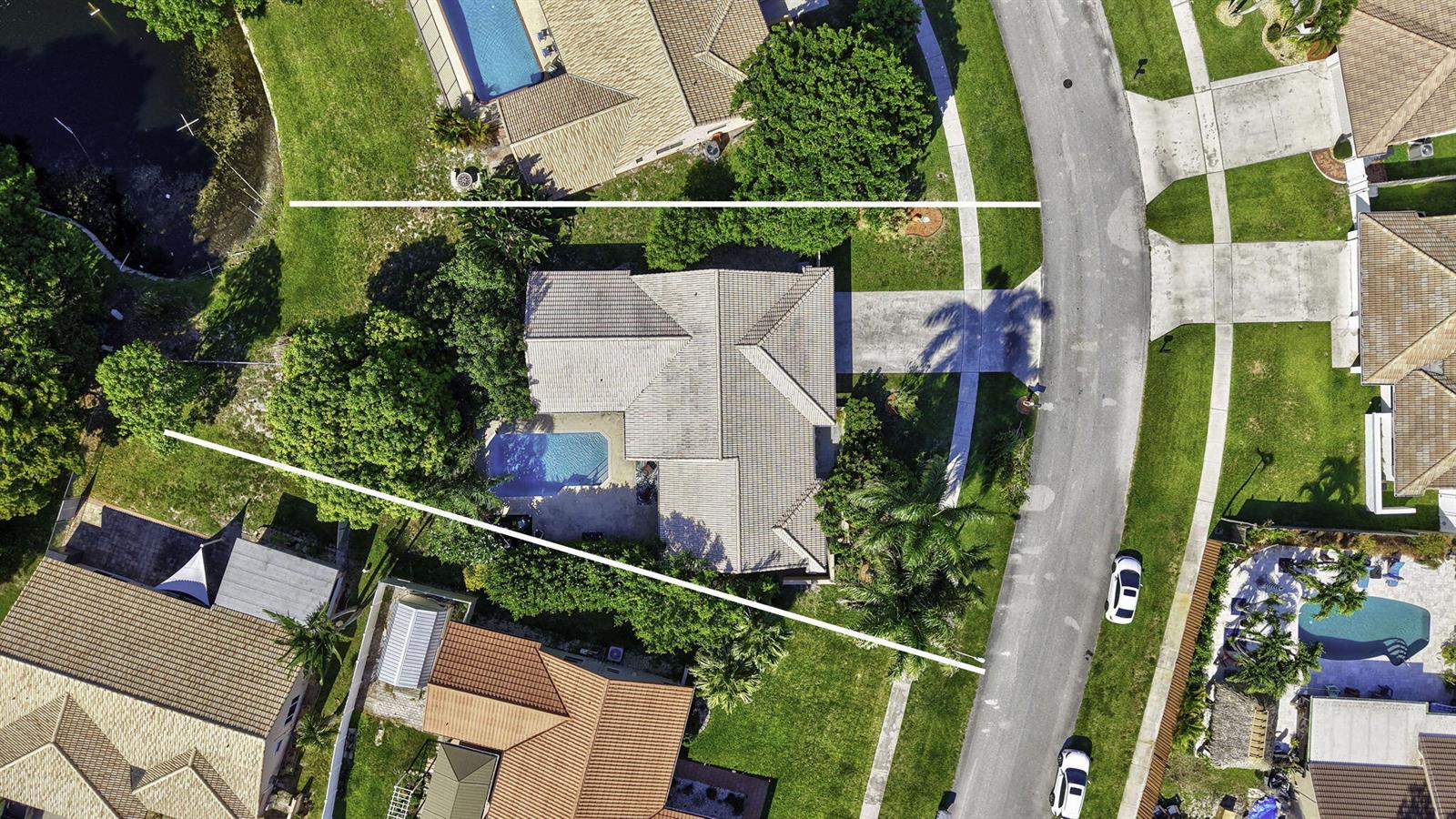 An aerial view shows a residential house with a pool and a large backyard — 9577 Majestic Way, Boynton Beach FL 33437, BOYNTON BEACH, FL