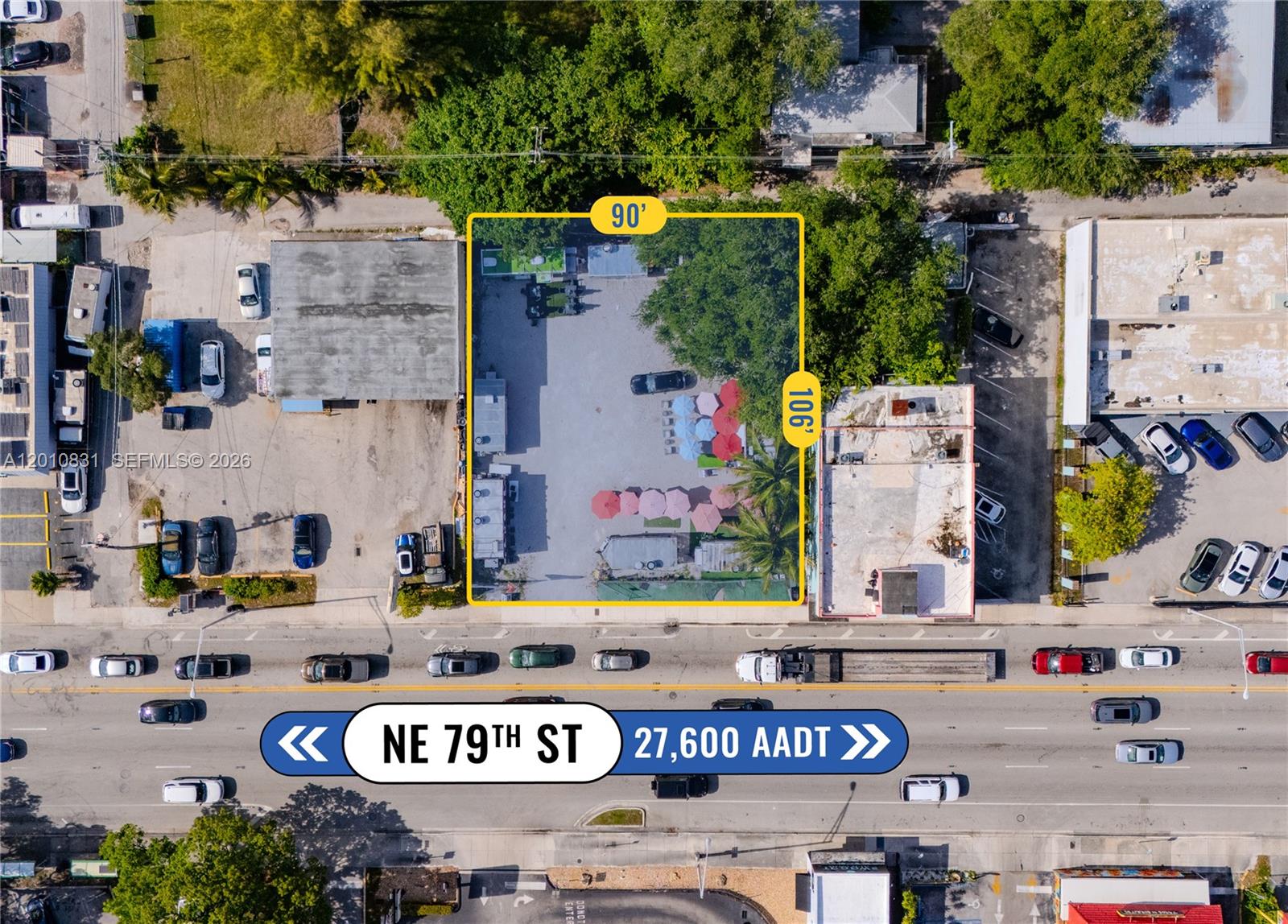 This aerial view shows a rectangular commercial lot with a parking area and trees — 633 NE 79th St, Miami FL 33138, MIAMI, FL