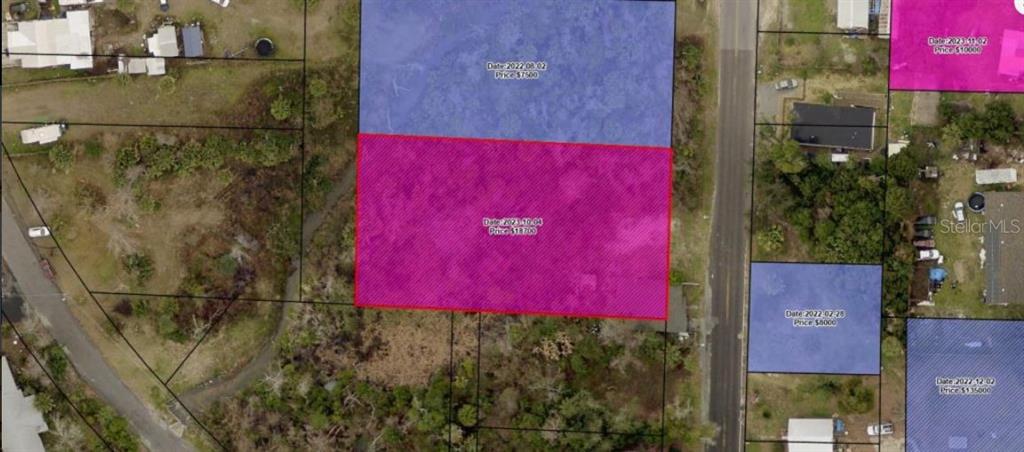 This is an aerial map showing highlighted land parcels with associated dates and prices — 135 EVERITT AVENUE, PANAMA CITY, FL