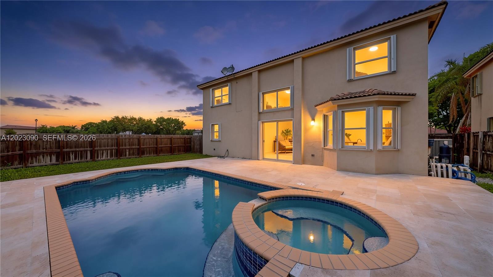 A two-story house exterior features a swimming pool, a spa, and a fenced backyard — 1730 SE 20th Ter, Homestead FL 33035, HOMESTEAD, FL