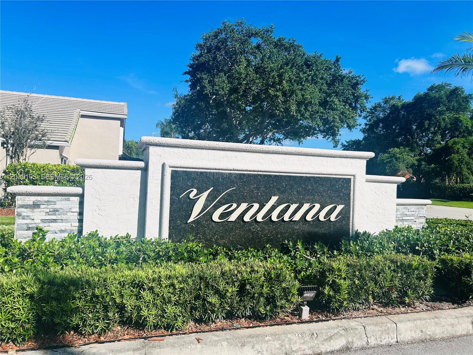 A white stucco monument sign with the name Ventana sits in front of green landscaping — 11637 NW 3rd Dr, Coral Springs FL 33071, CORAL SPRINGS, FL