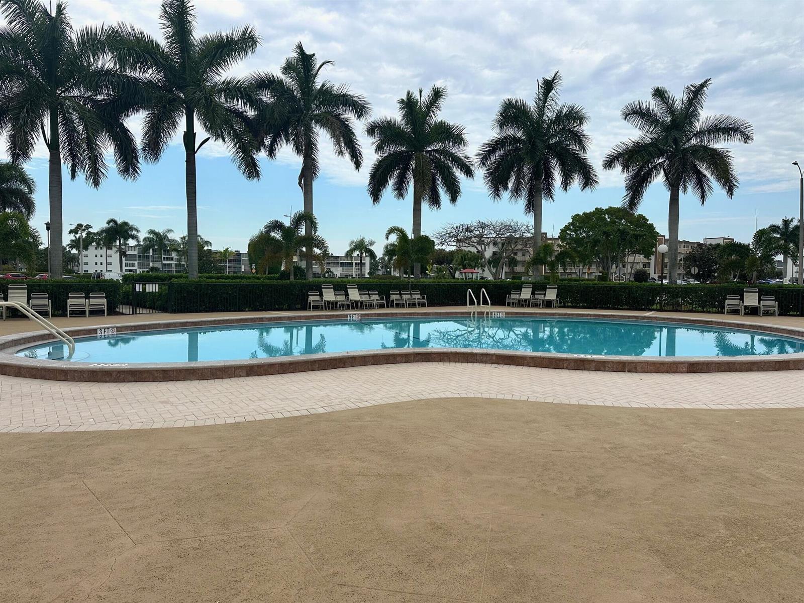 A kitchen with white cabinets, granite countertops, and stainless steel appliances — 454 Fanshaw K, Boca Raton FL 33434, BOCA RATON, FL