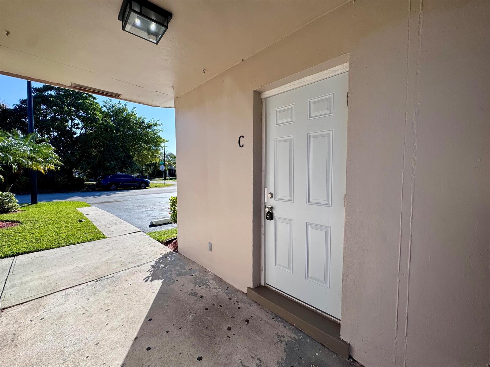 A kitchen features white appliances, subway tile backsplash, granite countertops, and tile flooring — 3101 NE 7th Avenue # B, Pompano Beach FL 33064, POMPANO BEACH, FL