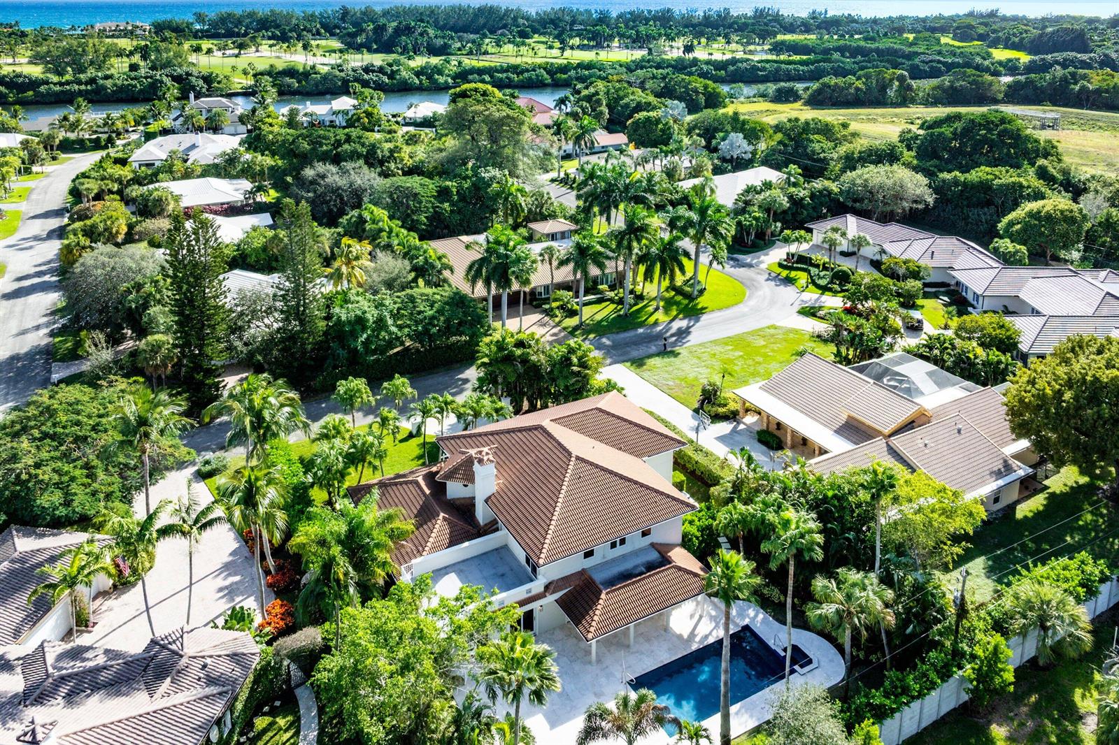 An aerial view of a residential neighborhood featuring houses with tiled roofs and swimming pools — 2570 Avenue Au Soleil, Delray Beach FL 33483, DELRAY BEACH, FL