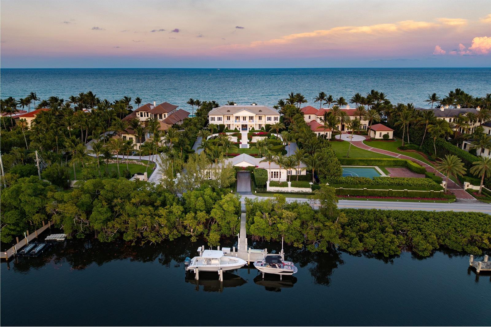 An aerial view of a waterfront mansion with a private dock, pool, and lush landscaping — 640 S Ocean Boulevard, Manalapan FL 33462, MANALAPAN, FL