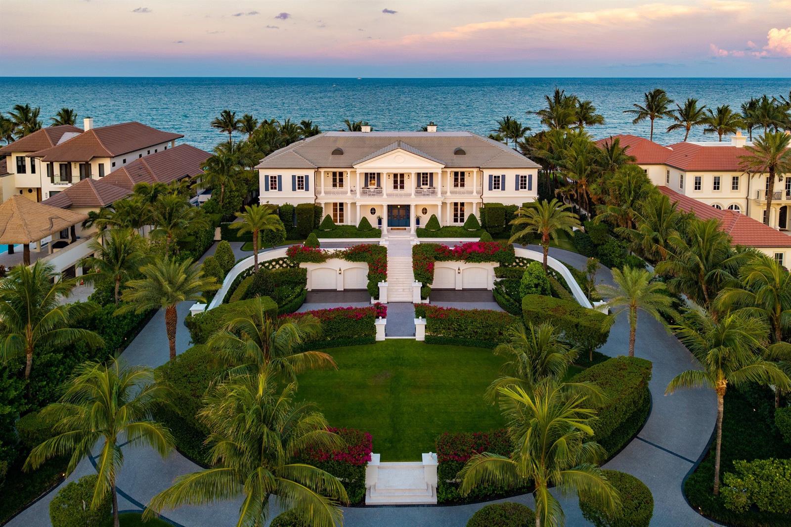 An aerial view of a large white mansion with a landscaped lawn and oceanfront setting — 640 S Ocean Boulevard, Manalapan FL 33462, MANALAPAN, FL