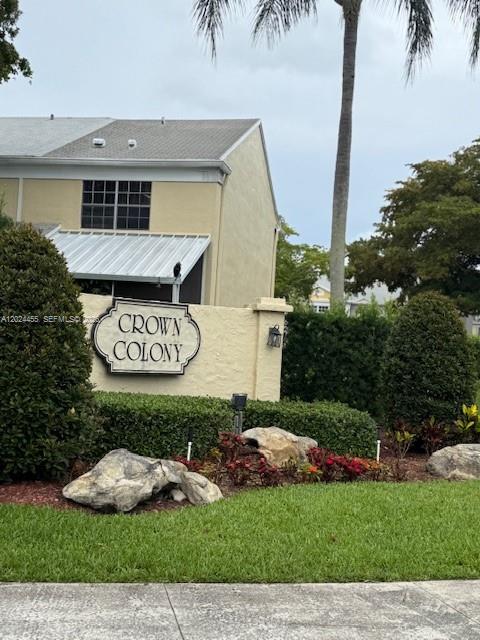 A sign for Crown Colony stands in front of a multi-story building with landscaping — 2856 Cambridge Ln, Cooper City FL 33026, COOPER CITY, FL