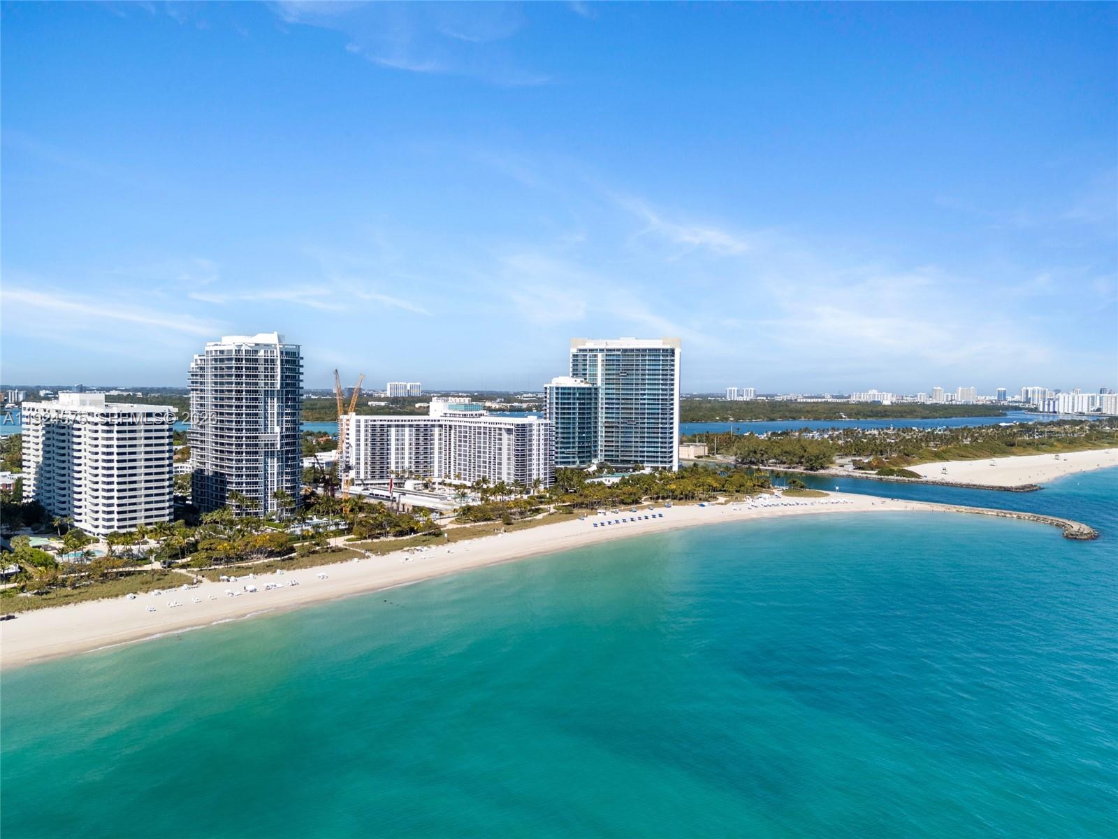 An aerial view of a sandy beach with high-rise buildings along the coastline — 10225 Collins Ave # 404, Bal Harbour FL 33154, BAL HARBOUR, FL