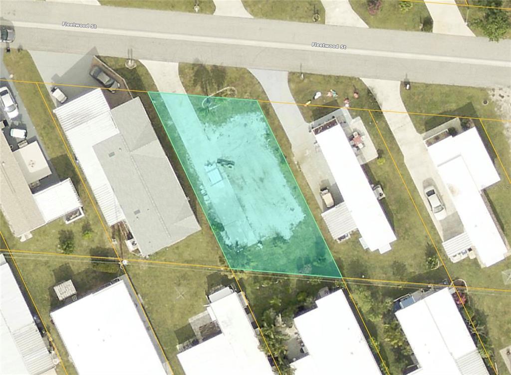 This is an aerial map view of a vacant residential lot highlighted in green — 519 FLEETWOOD STREET, NORTH PORT, FL