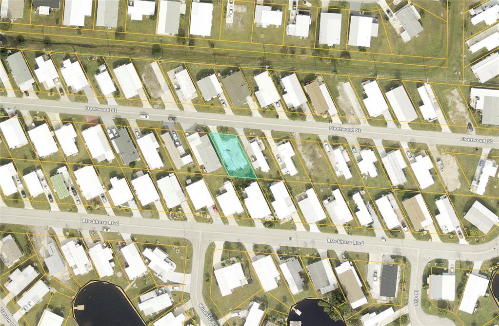 This is an aerial map view of a residential neighborhood with a highlighted vacant lot — 519 FLEETWOOD STREET, NORTH PORT, FL