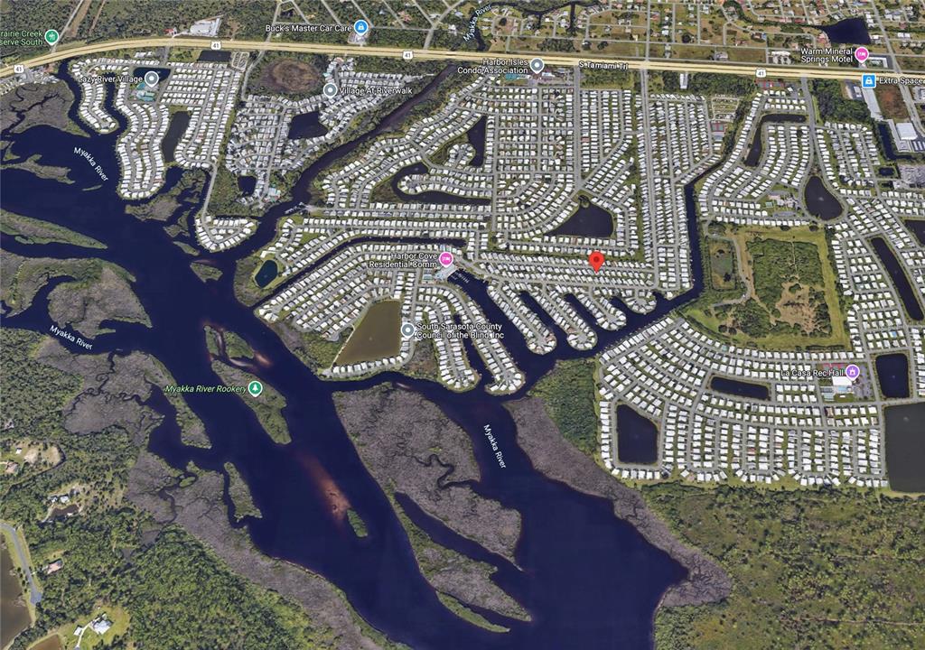 This is an aerial map view of a residential neighborhood along the Myakka River — 519 FLEETWOOD STREET, NORTH PORT, FL