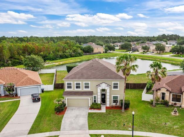 An aerial view shows a community pool area with a playground and a small pond — 2813 Village Pine Ter, Orlando FL 32833, ORLANDO, FL