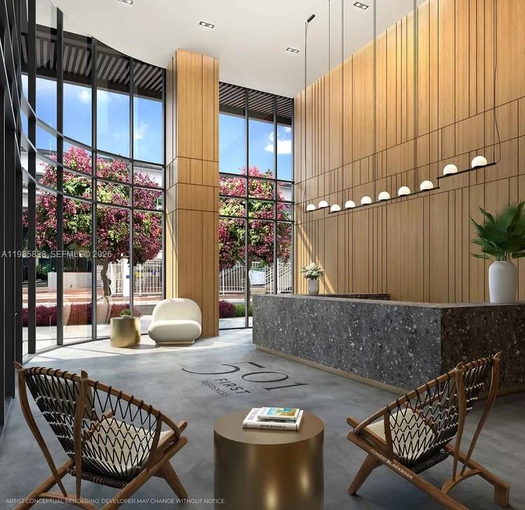 This architectural rendering shows a modern lobby with floor-to-ceiling windows, wood paneling, and stone reception — 121 NE 5th ST # 912A, Miami FL 33132, MIAMI, FL