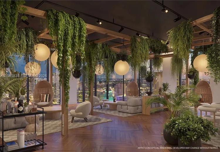 This rendering shows a modern indoor lounge area filled with hanging plants and globe lighting — 121 NE 5th ST # 912A, Miami FL 33132, MIAMI, FL