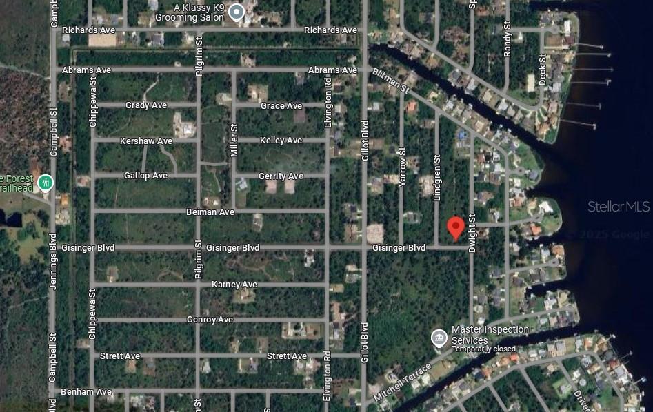 This is a satellite map view showing residential streets and wooded lots — 3527 DWIGHT STREET, PORT CHARLOTTE, FL