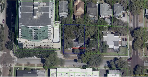 This aerial map shows a residential lot highlighted in blue between larger commercial and residential buildings — 617 E CHURCH STREET, ORLANDO, FL