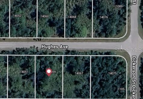 This is a satellite map view showing a vacant residential lot marked with a location pin — 14059 HUGHES AVENUE, PORT CHARLOTTE, FL