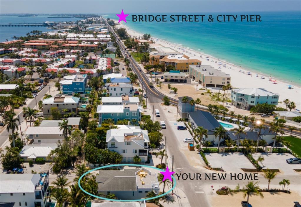 An aerial view shows a coastal neighborhood with a house circled near a beach — 2201 AVENUE C, BRADENTON BEACH, FL
