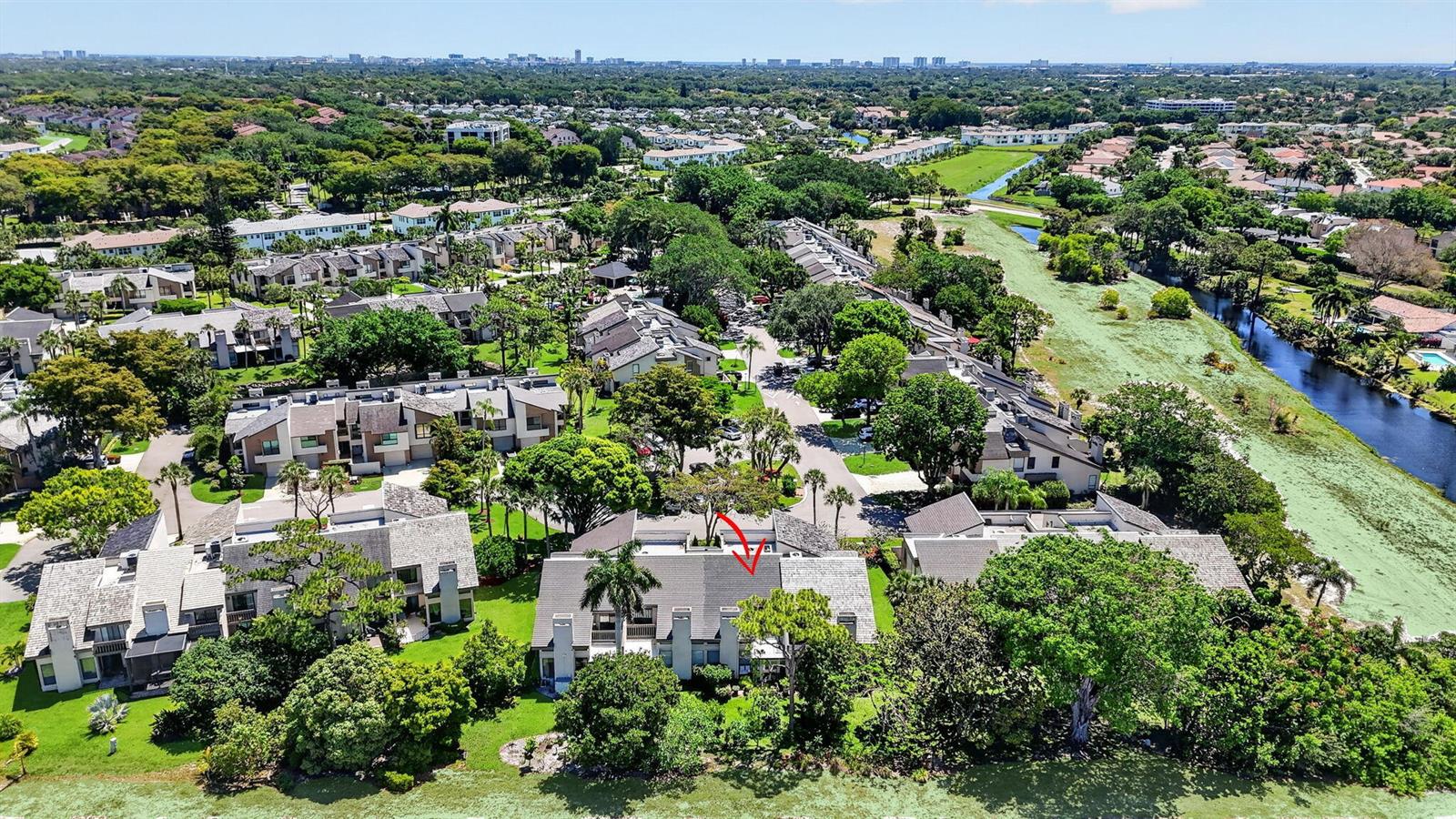 An aerial view shows a multi-unit residential building with a red arrow pointing to a roof — 6062 Glendale Drive, Boca Raton FL 33433, BOCA RATON, FL