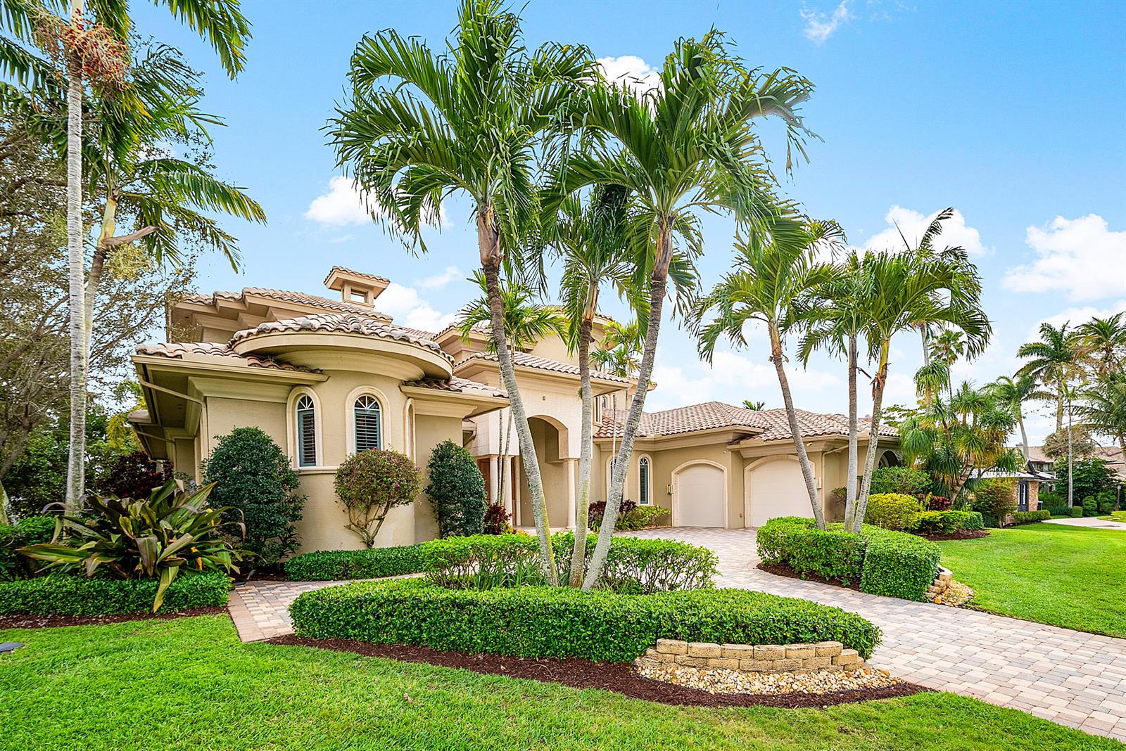 A two-story house with a beige stucco exterior, tile roof, and palm trees in front — 4304 Saint Andrews Drive, Boynton Beach FL 33436, BOYNTON BEACH, FL