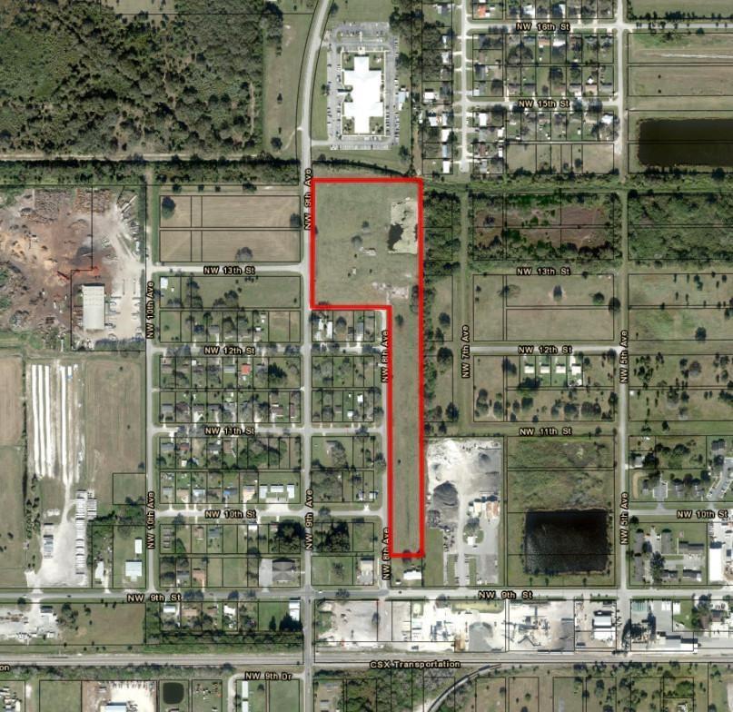 An aerial map shows a large, L-shaped parcel of land outlined in red — 1202 NW 8th Avenue, Okeechobee FL 34972, OKEECHOBEE, FL