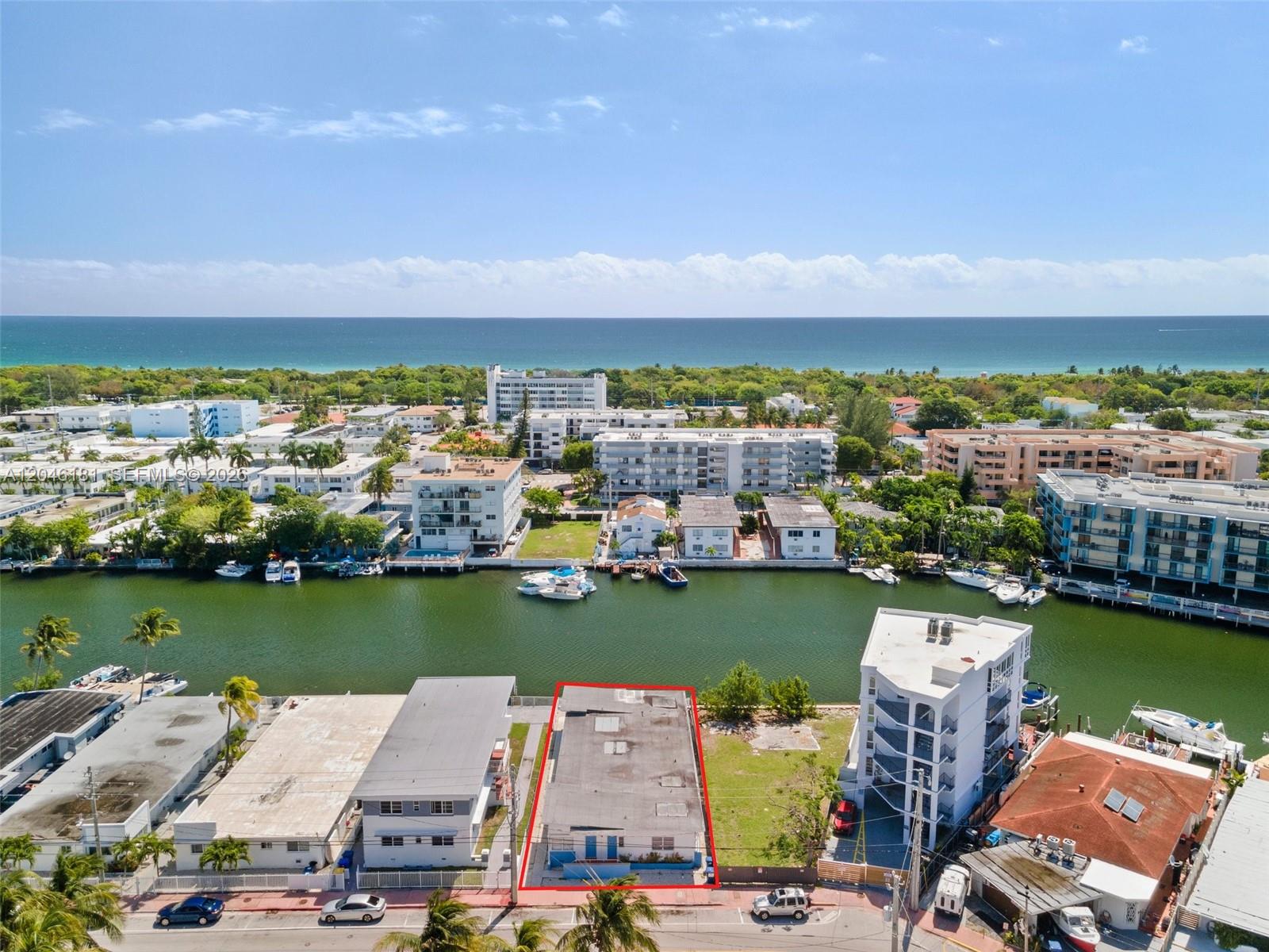 An aerial view shows a rectangular building outlined in red along a waterfront canal — 8135 Crespi Blvd # 4, Miami Beach FL 33141, MIAMI BEACH, FL