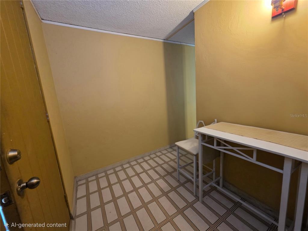 This room features yellow walls, tiled flooring, and a white console table — 37 RIO TURABO UNIT AW11, BAYAMON, PR