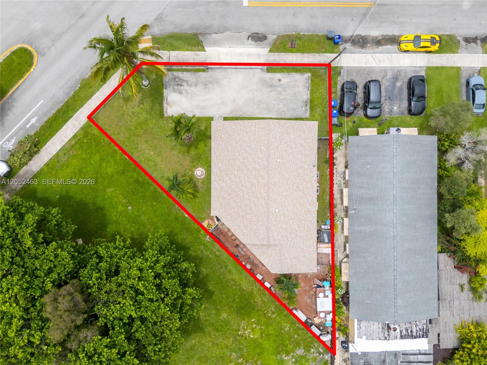 This aerial view shows a residential property lot outlined in red with a house — 5829 Taylor St, Hollywood FL 33021, HOLLYWOOD, FL