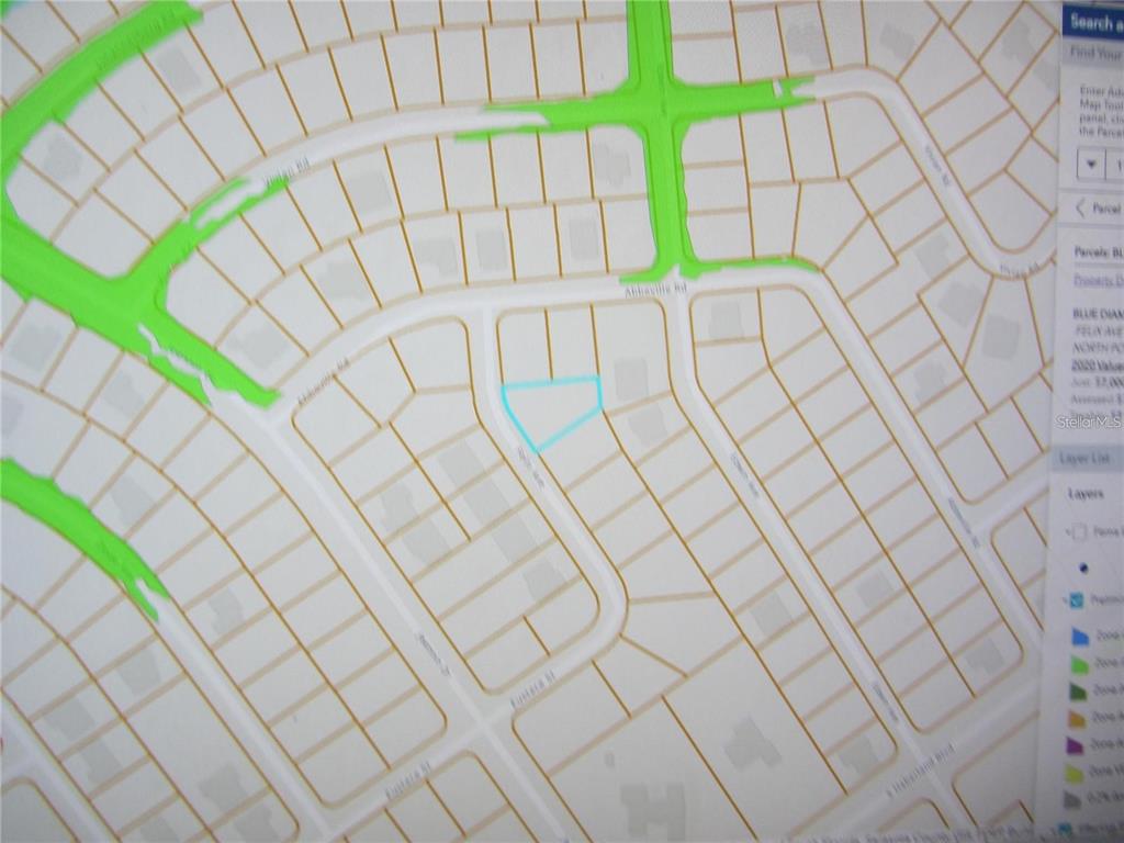 This is a digital map showing property parcel lines and street layouts in a residential neighborhood — FELIX AVENUE, NORTH PORT, FL
