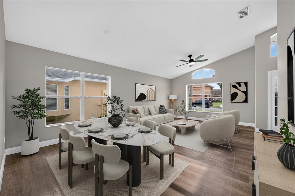 This virtual staging shows an open-concept living and dining room with light-colored furniture and flooring — 14229 SAPPHIRE BAY CIRCLE, ORLANDO, FL
