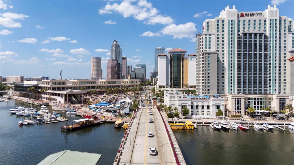 An elevated view of the Tampa skyline, a bridge, and a marina with docked boats — 700 S HARBOUR ISLAND BOULEVARD UNIT 813, TAMPA, FL