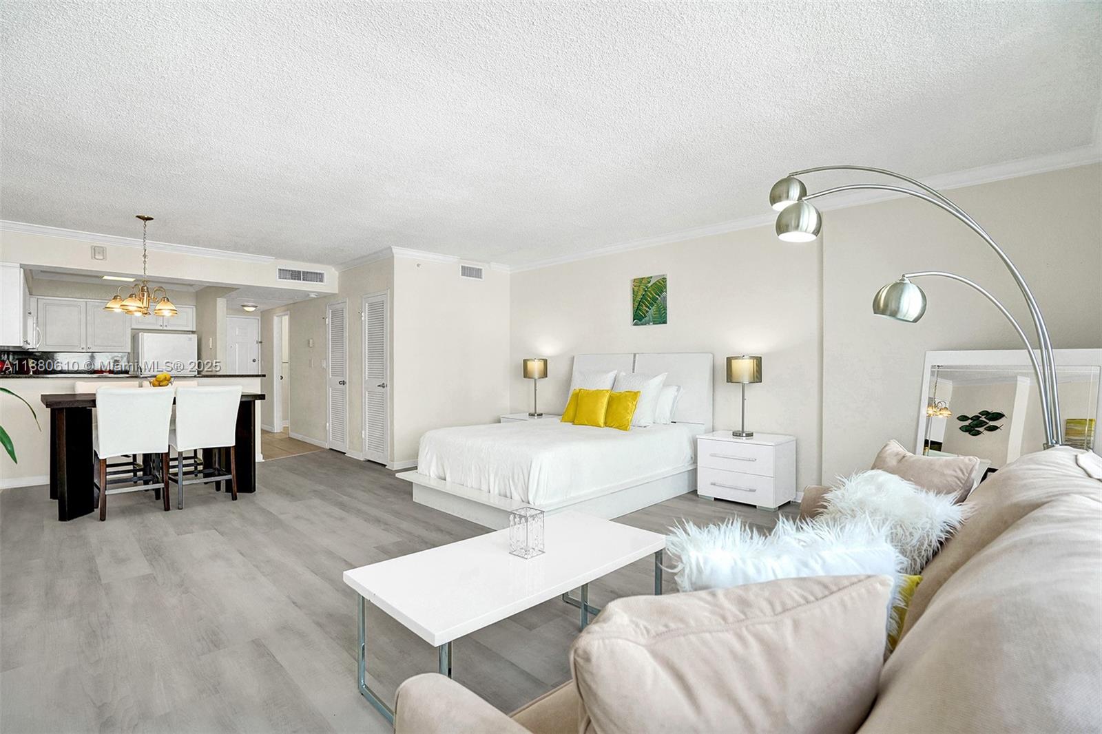 A studio apartment features a bed, a living area with a sofa, and a kitchen — 2501 S Ocean Dr, Hollywood FL 33019, HOLLYWOOD, FL