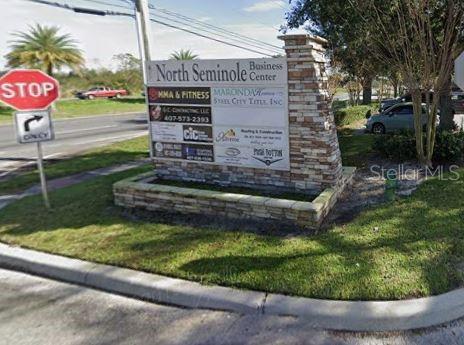 A stone monument sign for the North Seminole Business Center stands near a road — 4031 W STATE ROAD 46 UNIT C, SANFORD, FL