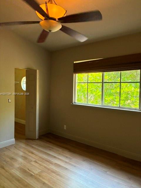 A bedroom with light wood-look flooring, a ceiling fan, and a window with blinds — 2551 SW 99th Way, Miramar FL 33025, MIRAMAR, FL