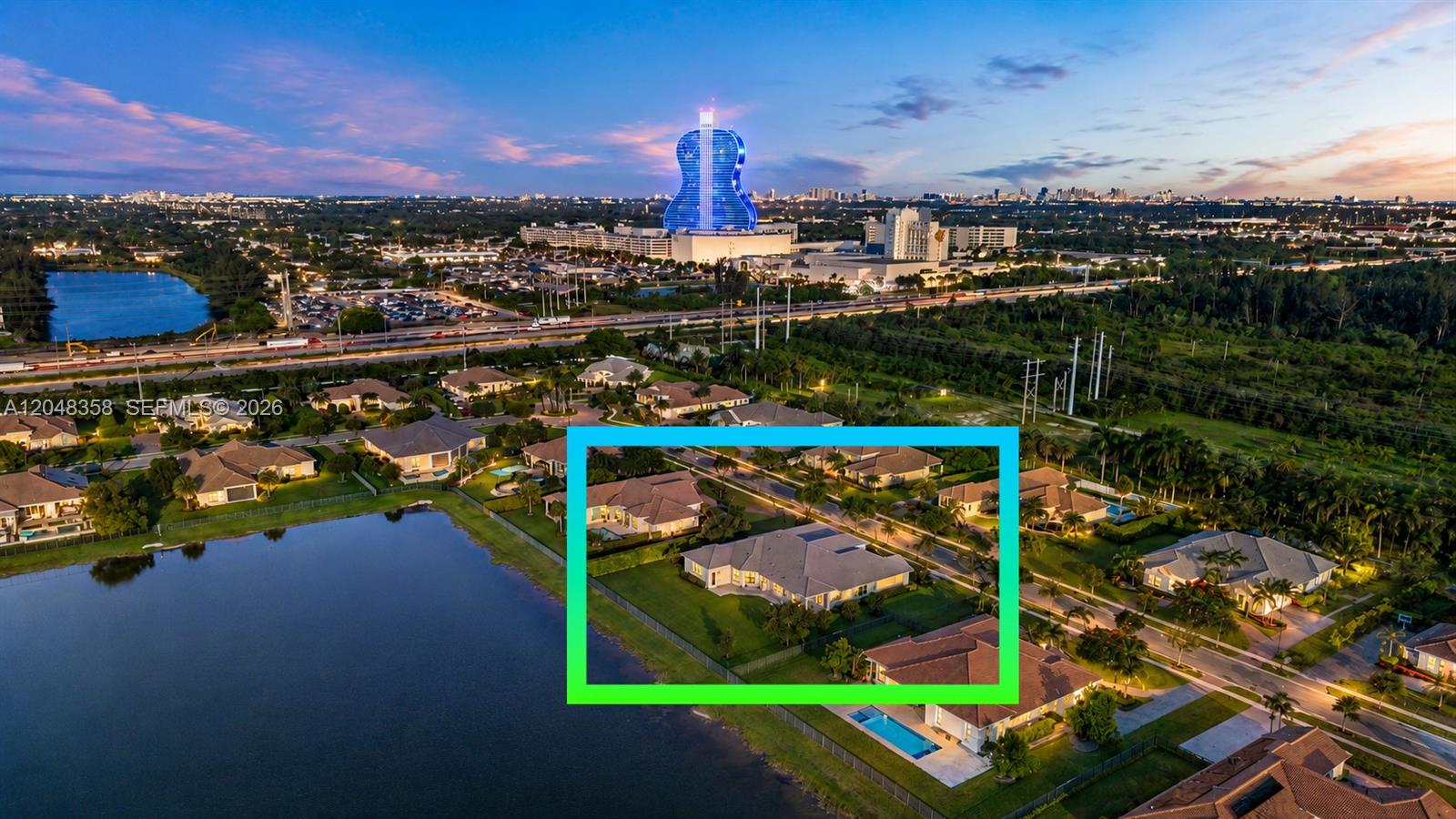 An aerial view shows a residential neighborhood with a highlighted house near a lake — 5301 S Sterling Ranch Cir, Davie FL 33314, DAVIE, FL