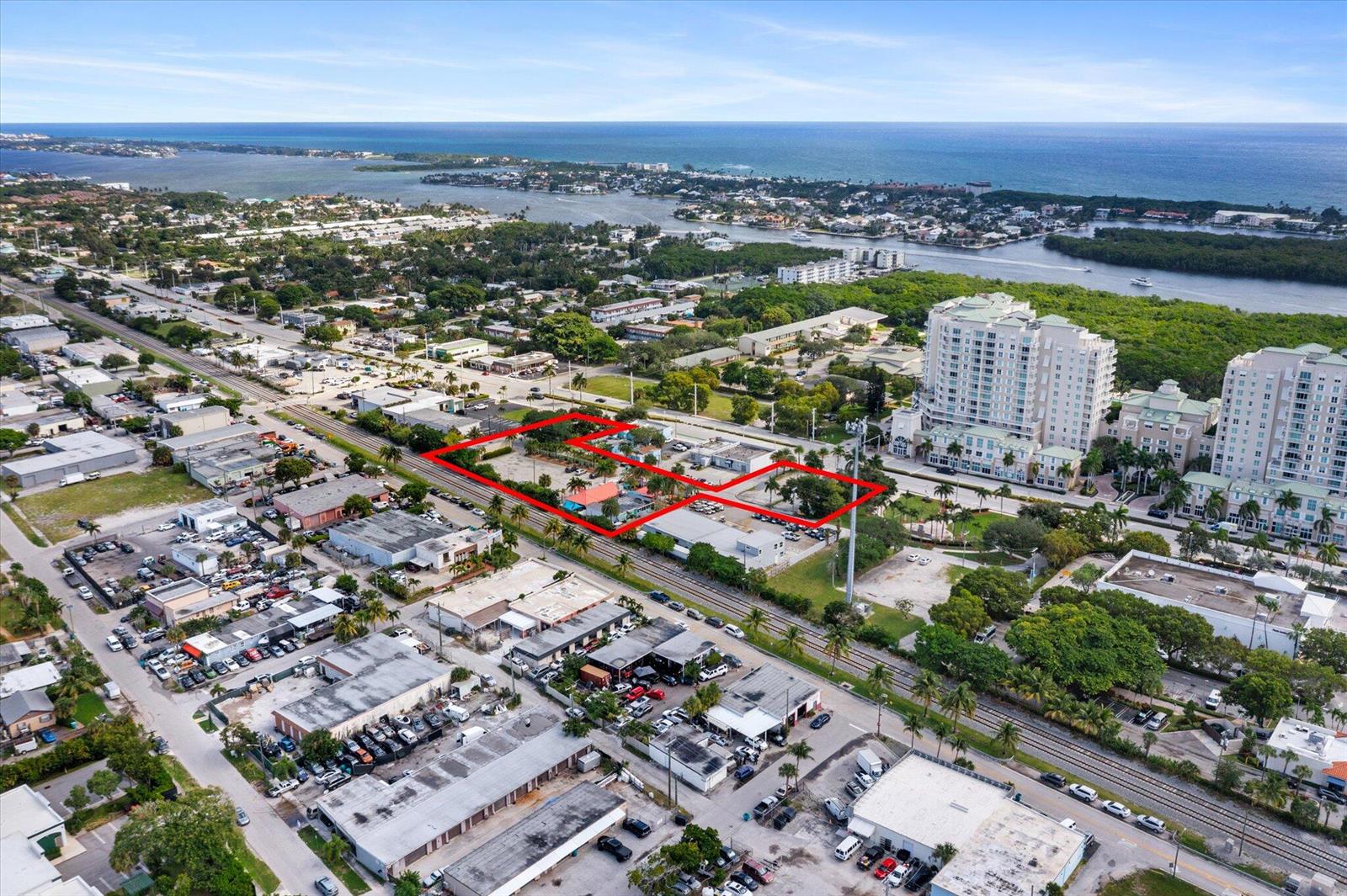 An aerial view shows a commercial property outlined in red near a railroad track — 511 NE 4th Street, Boynton Beach FL 33435, BOYNTON BEACH, FL