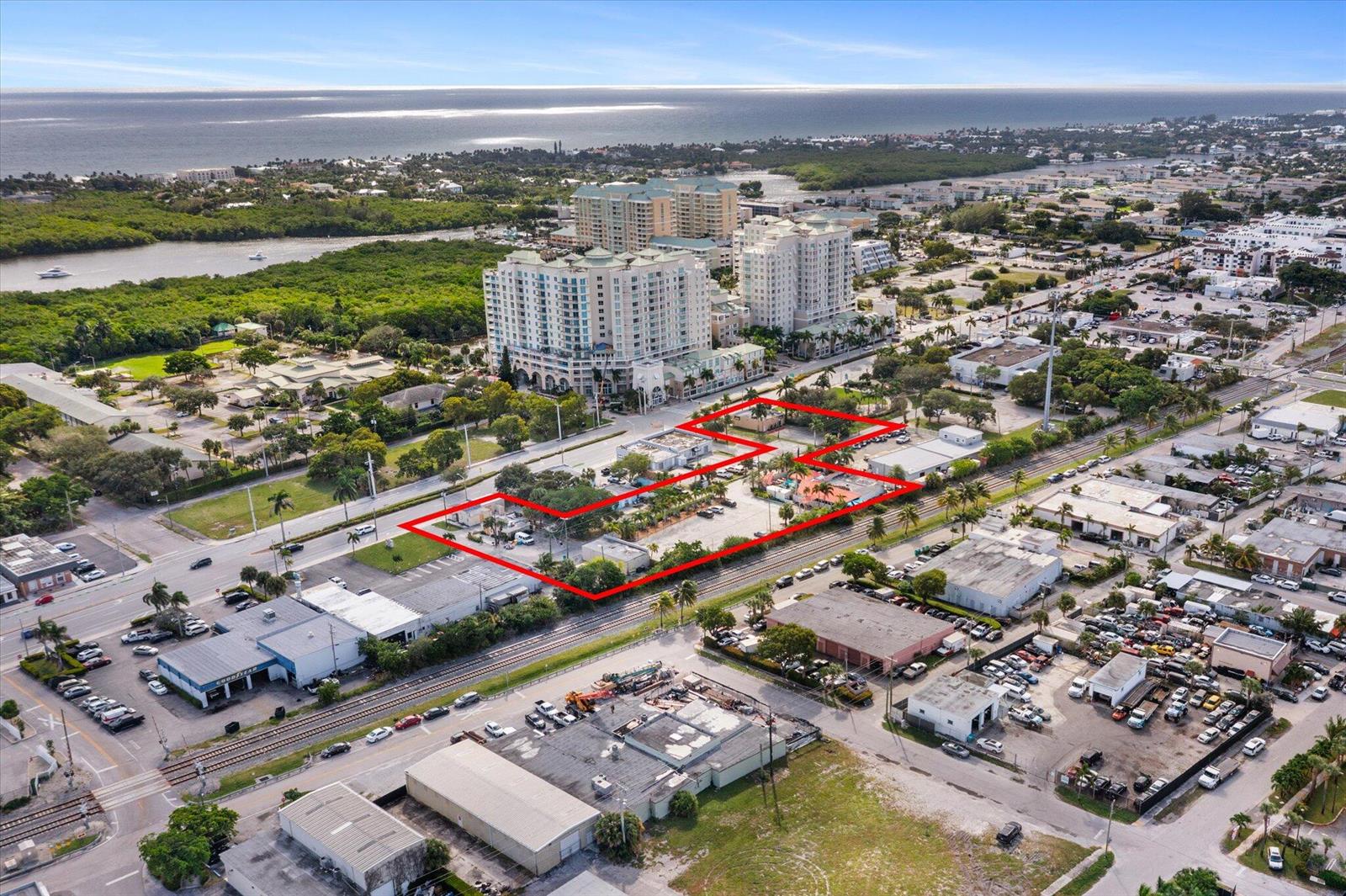 An aerial view shows a commercial property outlined in red near a railway and coast — 511 NE 4th Street, Boynton Beach FL 33435, BOYNTON BEACH, FL