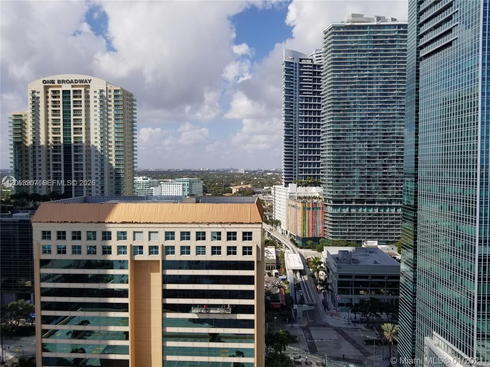 An elevated view of a city skyline featuring several high-rise buildings and a monorail track — 170 SE 14th St # 2205, Miami FL 33131, MIAMI, FL