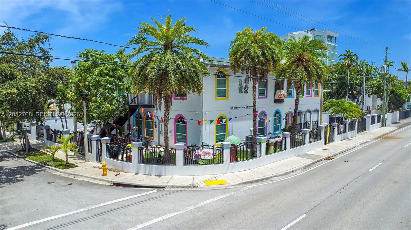 A two-story white building with colorful window frames and palm trees behind a fence — 2280 SW 17th Ave, Miami FL 33145, MIAMI, FL