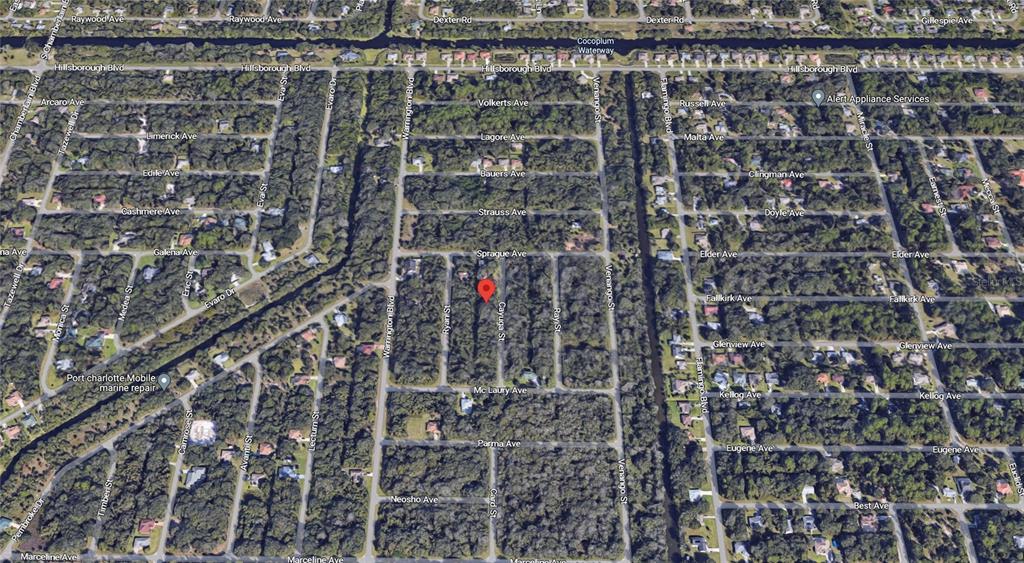 This is an aerial map view of a residential neighborhood with a red location pin — 187 CAYUGA STREET, PORT CHARLOTTE, FL