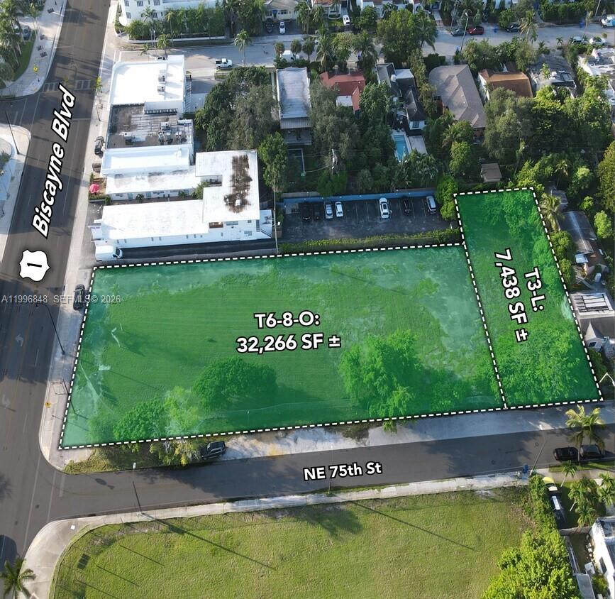An aerial view shows two adjacent vacant lots highlighted in green with zoning labels — 7460 Biscayne Blvd, Miami FL 33138, MIAMI, FL