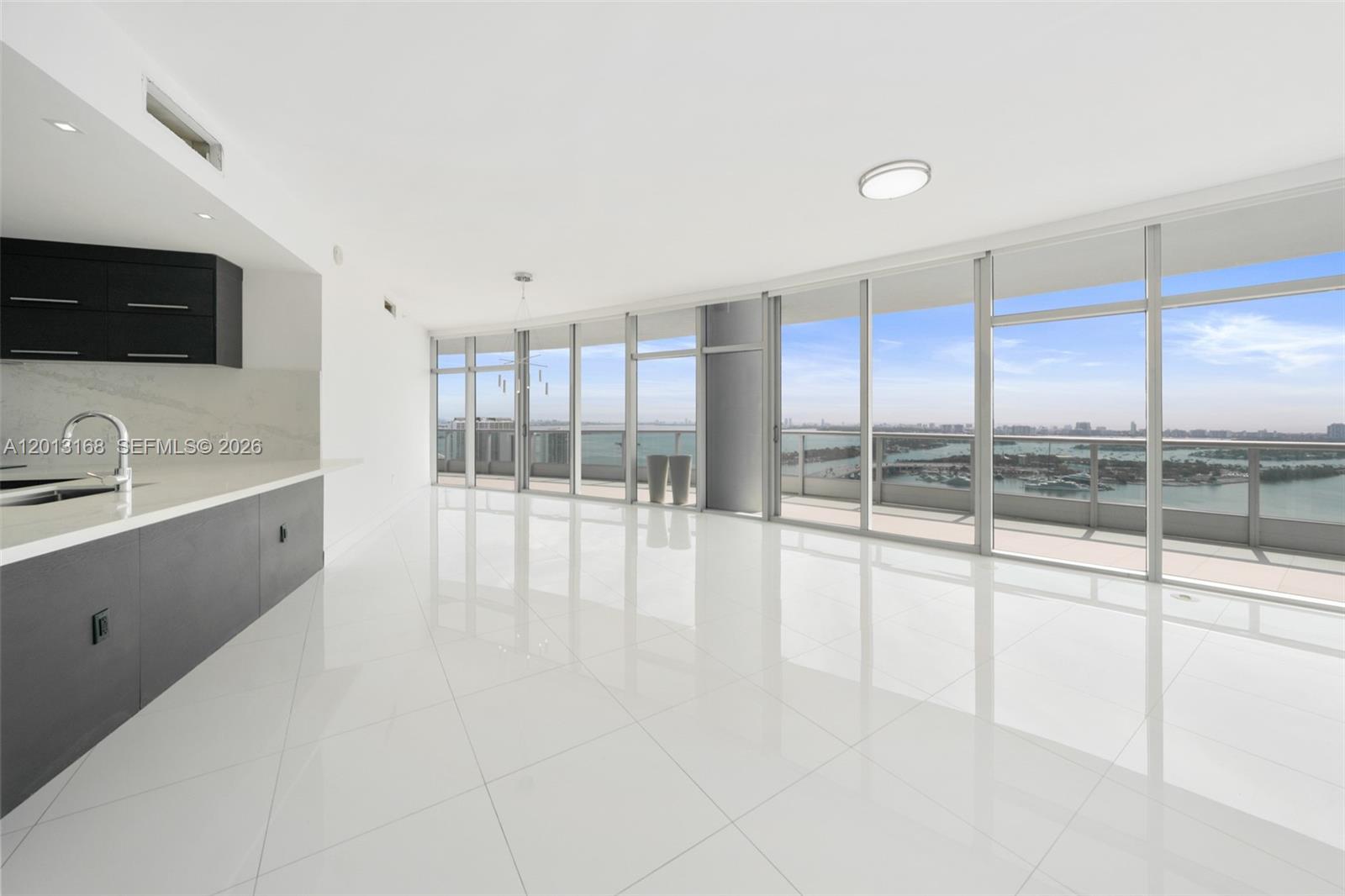 An elevated view shows the Kaseya Center, Biscayne Bay, and surrounding city buildings in Miami — 900 Biscayne Blvd # 4006, Miami FL 33132, MIAMI, FL