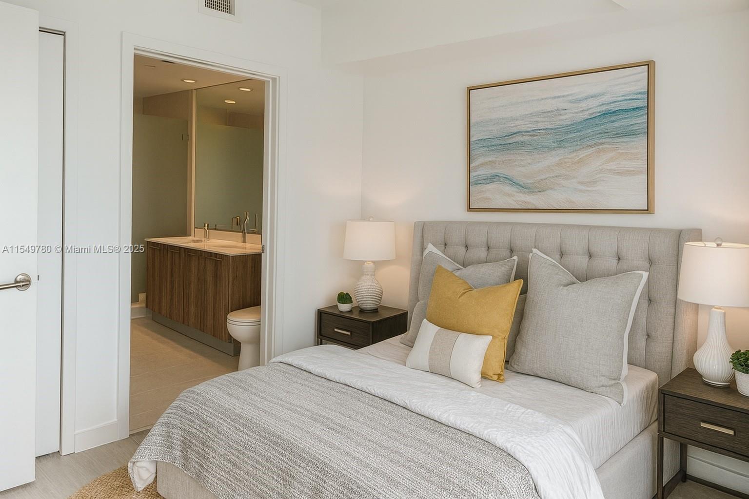 A bedroom features a tufted headboard, two nightstands with lamps, and an adjacent bathroom — 501 NE 31st St # 3004, Miami FL 33137, MIAMI, FL