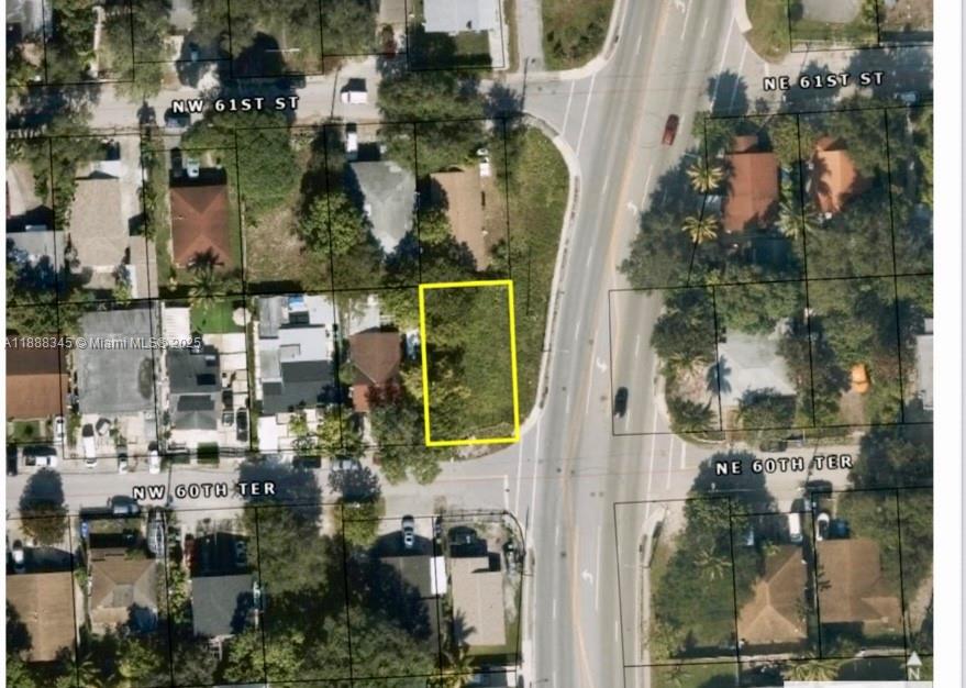 An aerial map view shows a vacant rectangular lot highlighted in yellow near a road — 6050 N Miami Ave, Miami FL 33137, MIAMI, FL